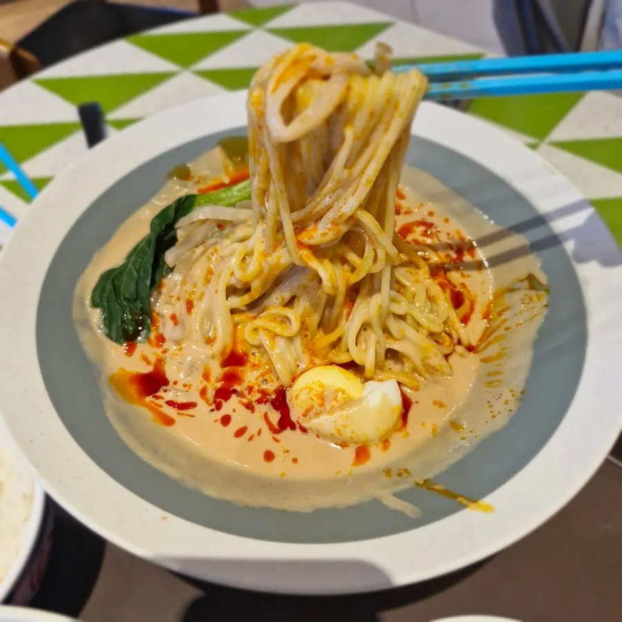 Close-up of the pale tantanmen topped with chili oil