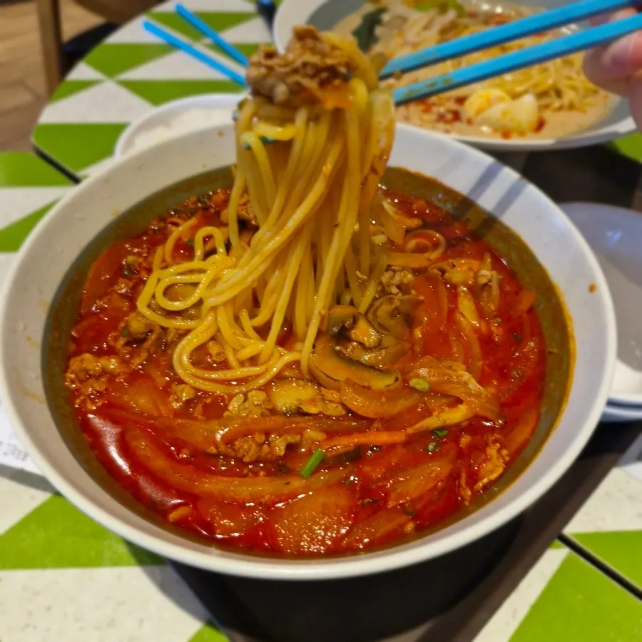 Noodles lifted up from the tantanmen bowl