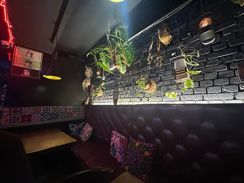 The brightly lit entrance of Chilango Seolleung Main Branch