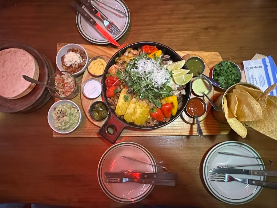 The cast-iron platter topped with grilled pineapple and bell peppers
