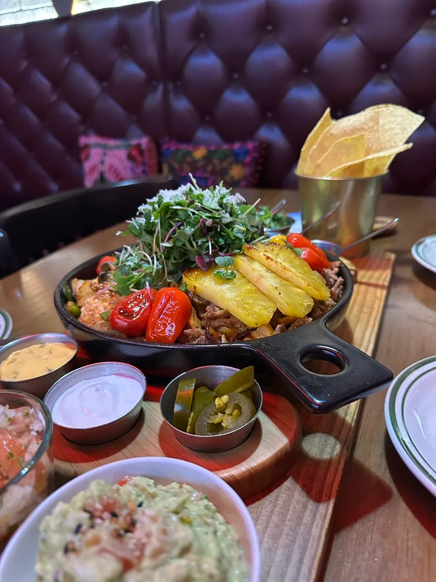 Close-up of the three meats on the cast-iron platter