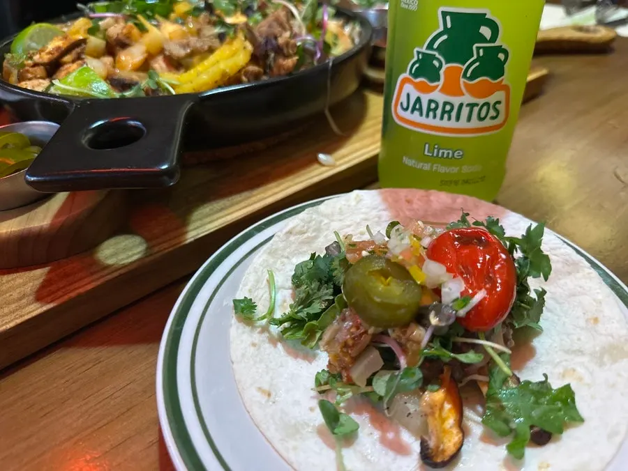 A finished taco built with a personal combination of ingredients
