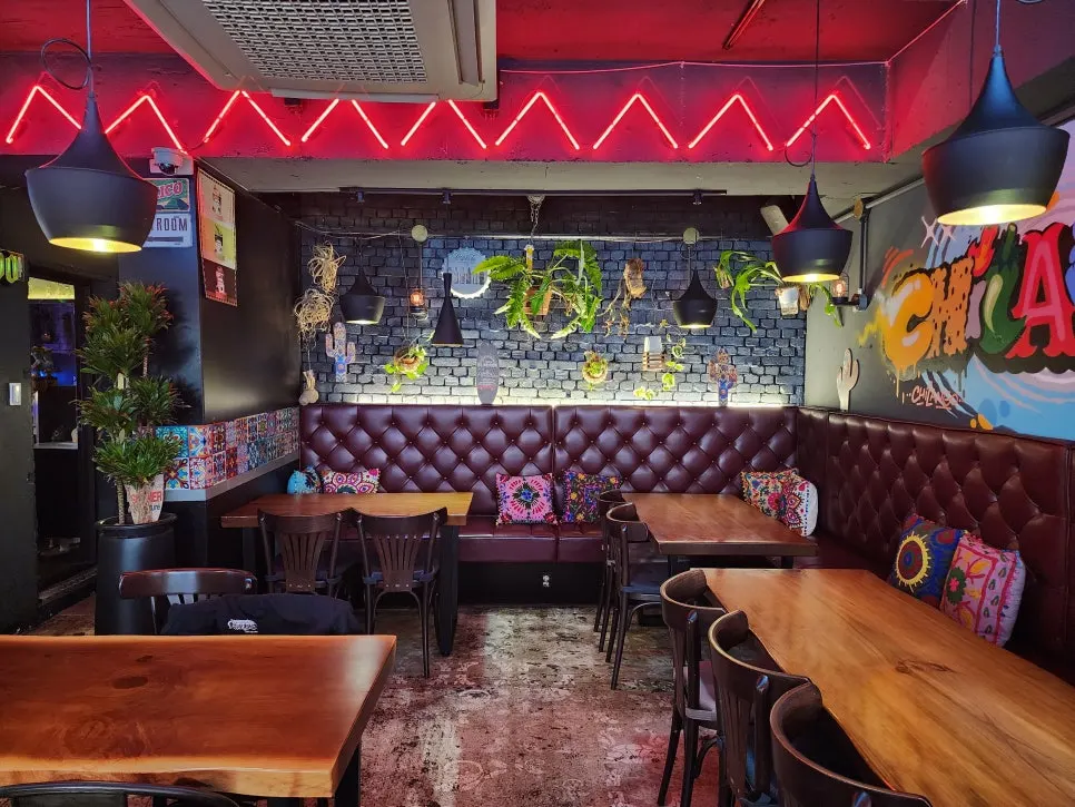 Table seating at Chilango under soft lighting