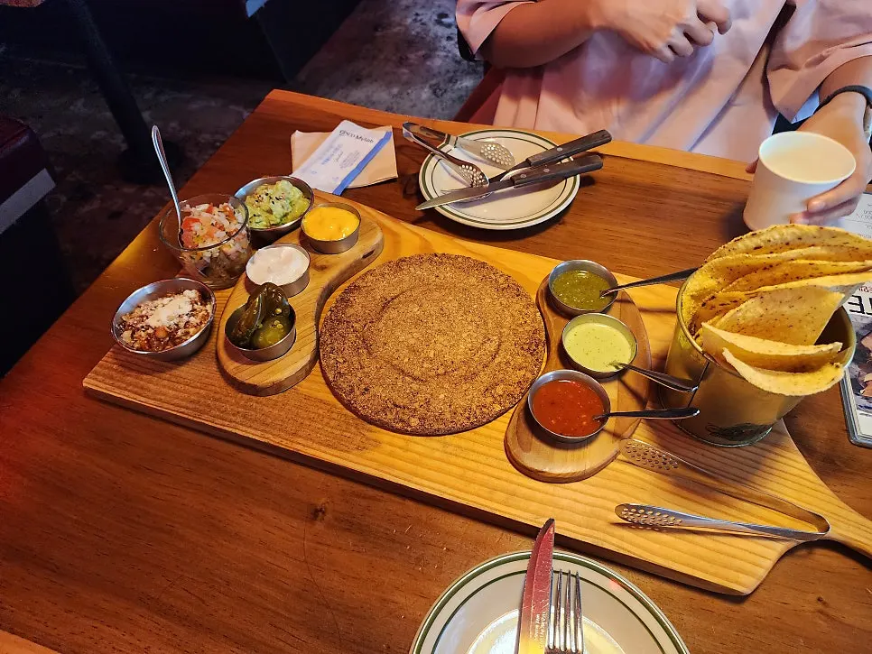 Taco ingredients served with vegetables and sauces