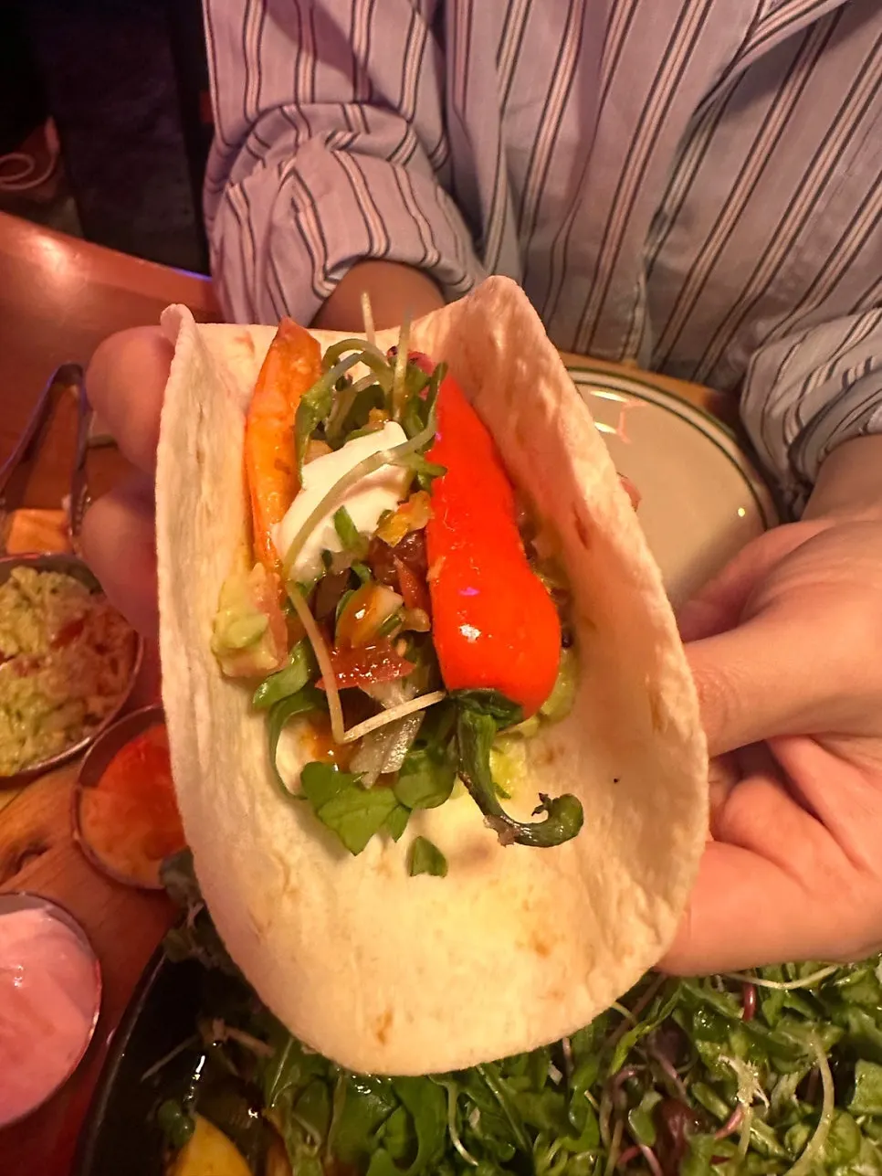 Beef taco with beef and vegetables on a tortilla