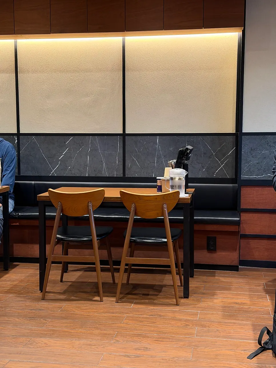 Restaurant with counter seats and tables for four