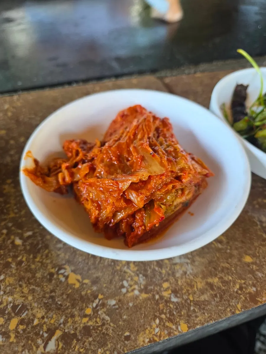 Basic side dishes and house-made aged kimchi