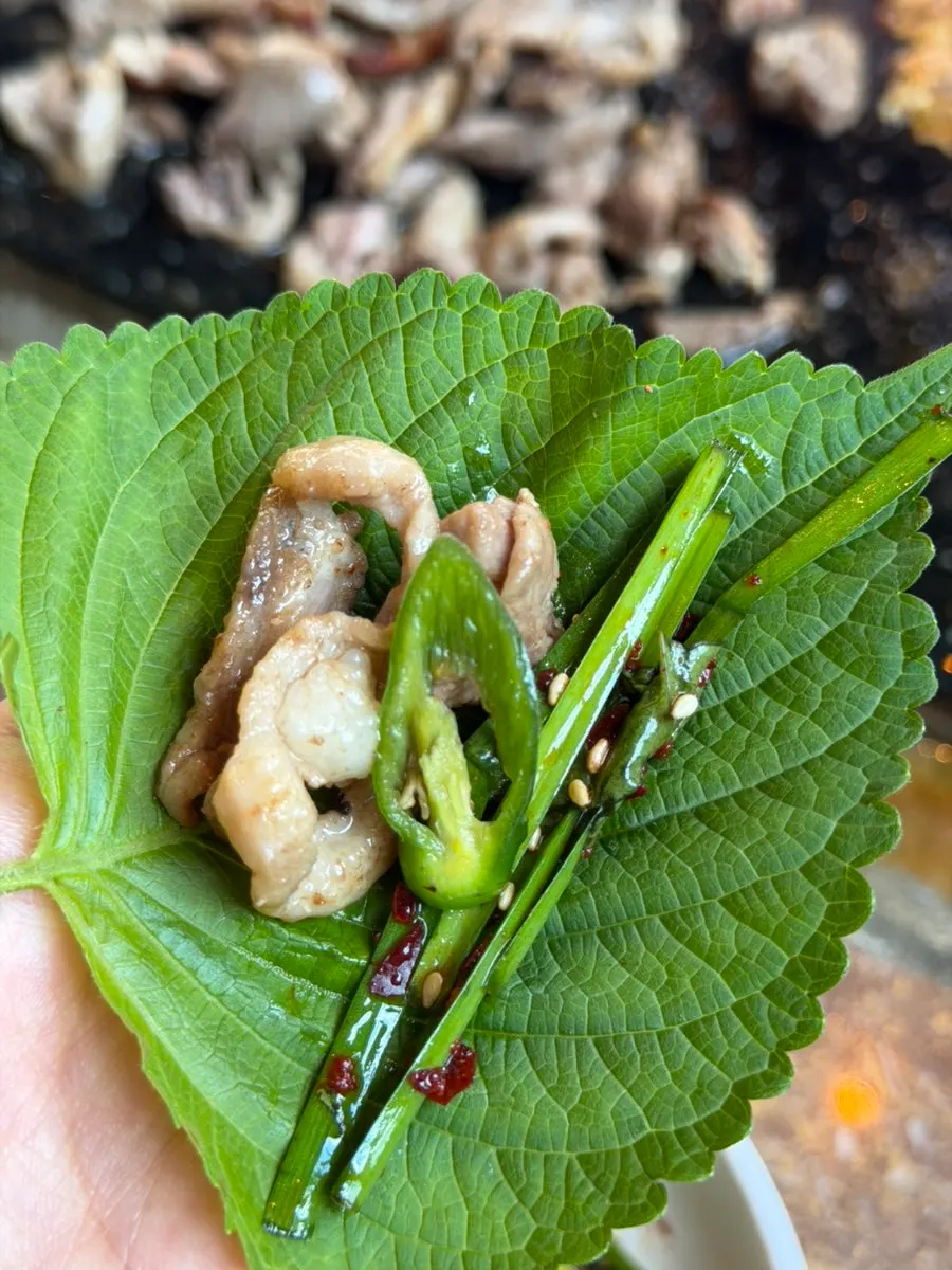 Grilled duck eaten in a leaf wrap