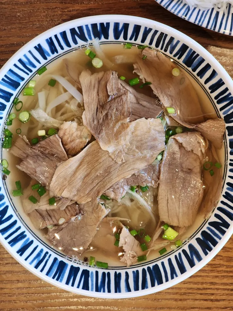 A bowl of meat-broth pho