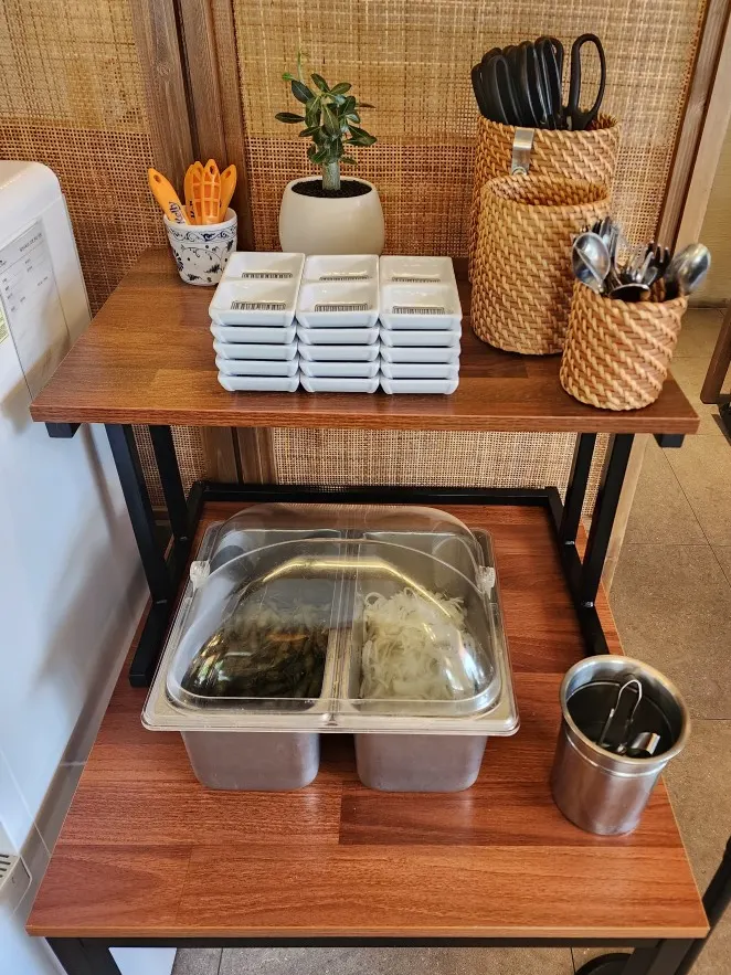 Self-serve bar with peppers and pickled onions