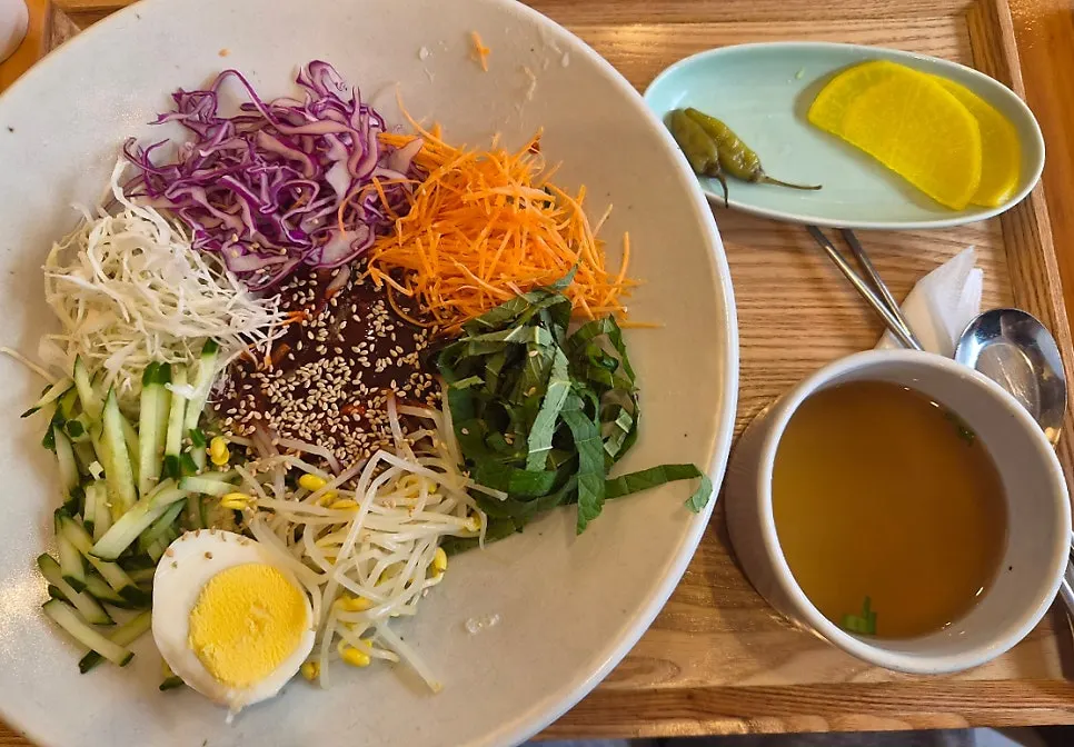 Horizontal shot of the cauldron-cooked fresh noodle soup