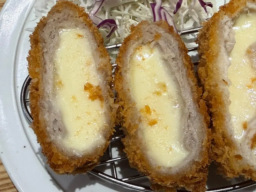 Plate of Real Cheese Pork Cutlet piled with cheese