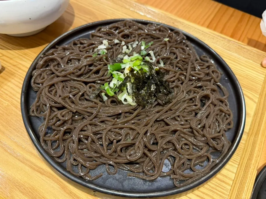 Table spread with pan buckwheat soba and cheese pork cutlet together