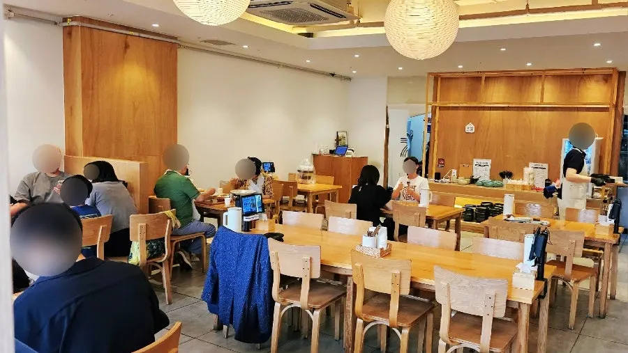 Wood-toned interior with center group seating