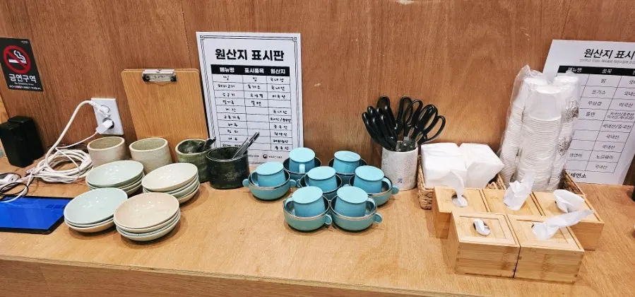 Self-serve corner with ice water tub, children's bowls and scissors