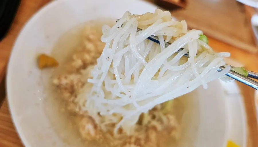 Chogye guksu noodles lifted with chopsticks