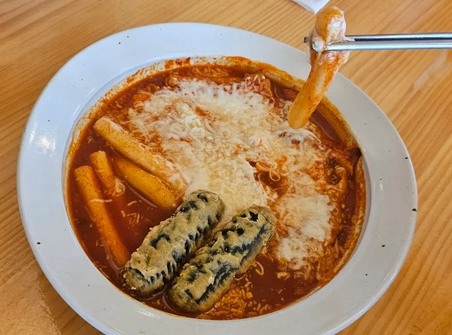 Rice cake sticks soaked in tteokbokki sauce