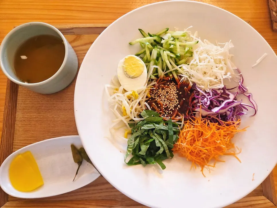 Table set with four ordered noodle dishes