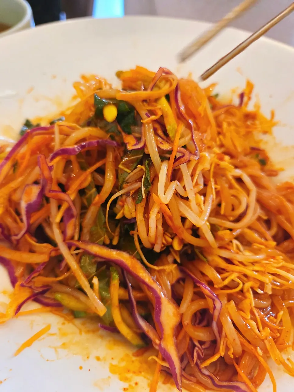 Bibim jjolmyeon topped generously with vegetables
