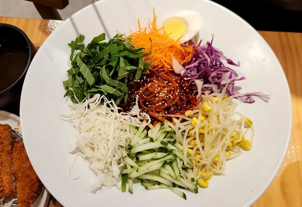 Bibim jjolmyeon piled high with vegetables