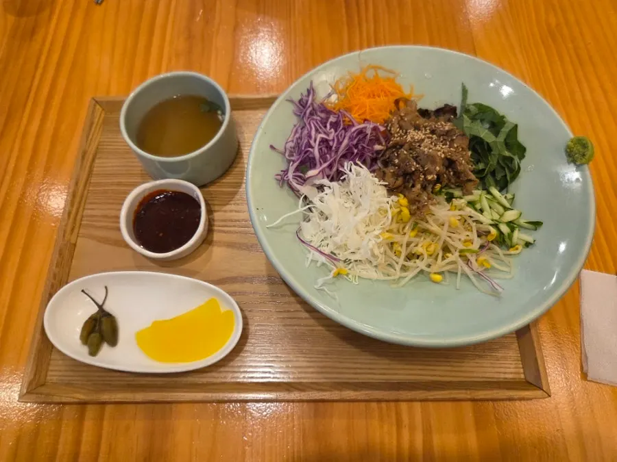 Charcoal beef short rib bibimbap topped with vegetables and beef
