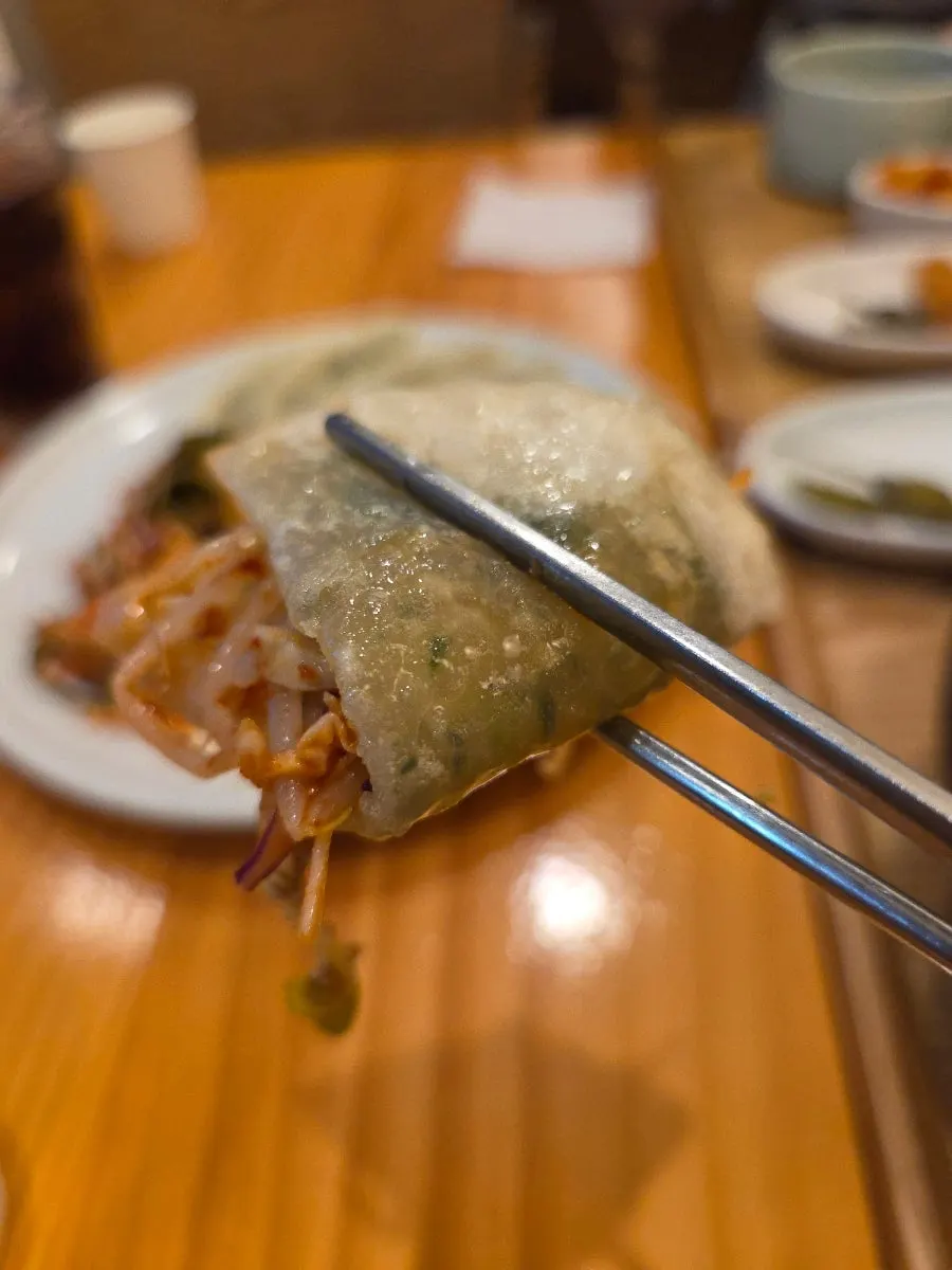 Close-up of crunchy seasoned vegetables and flat dumplings