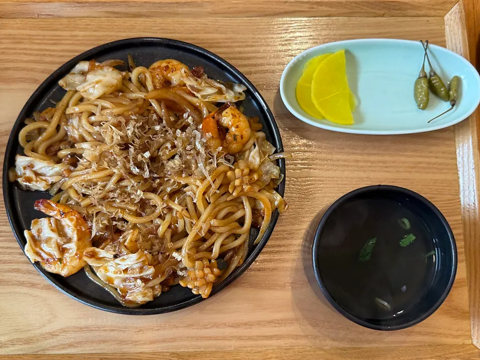 Noodles lifted up from the spicy hangover noodle soup