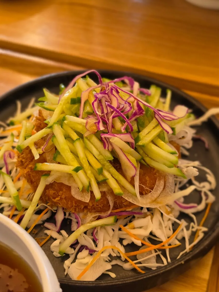 Aqua pork cutlet piled high with vegetables