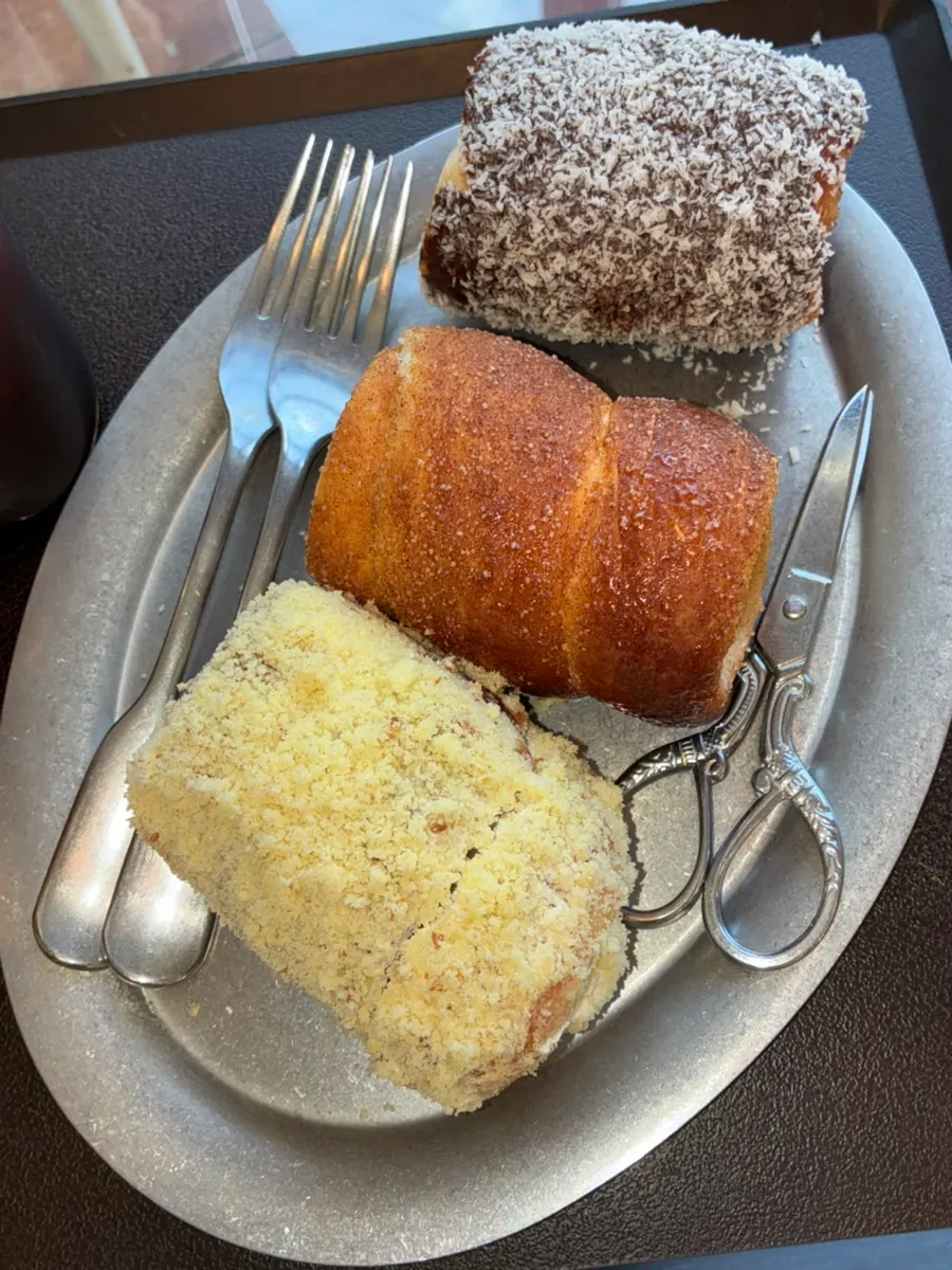 Chimney bread coated in dark chocolate and coconut powder