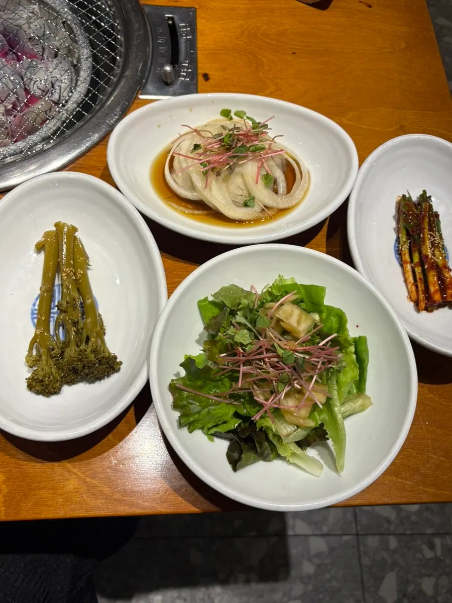 Side dish plate with japchae and seasoned crab