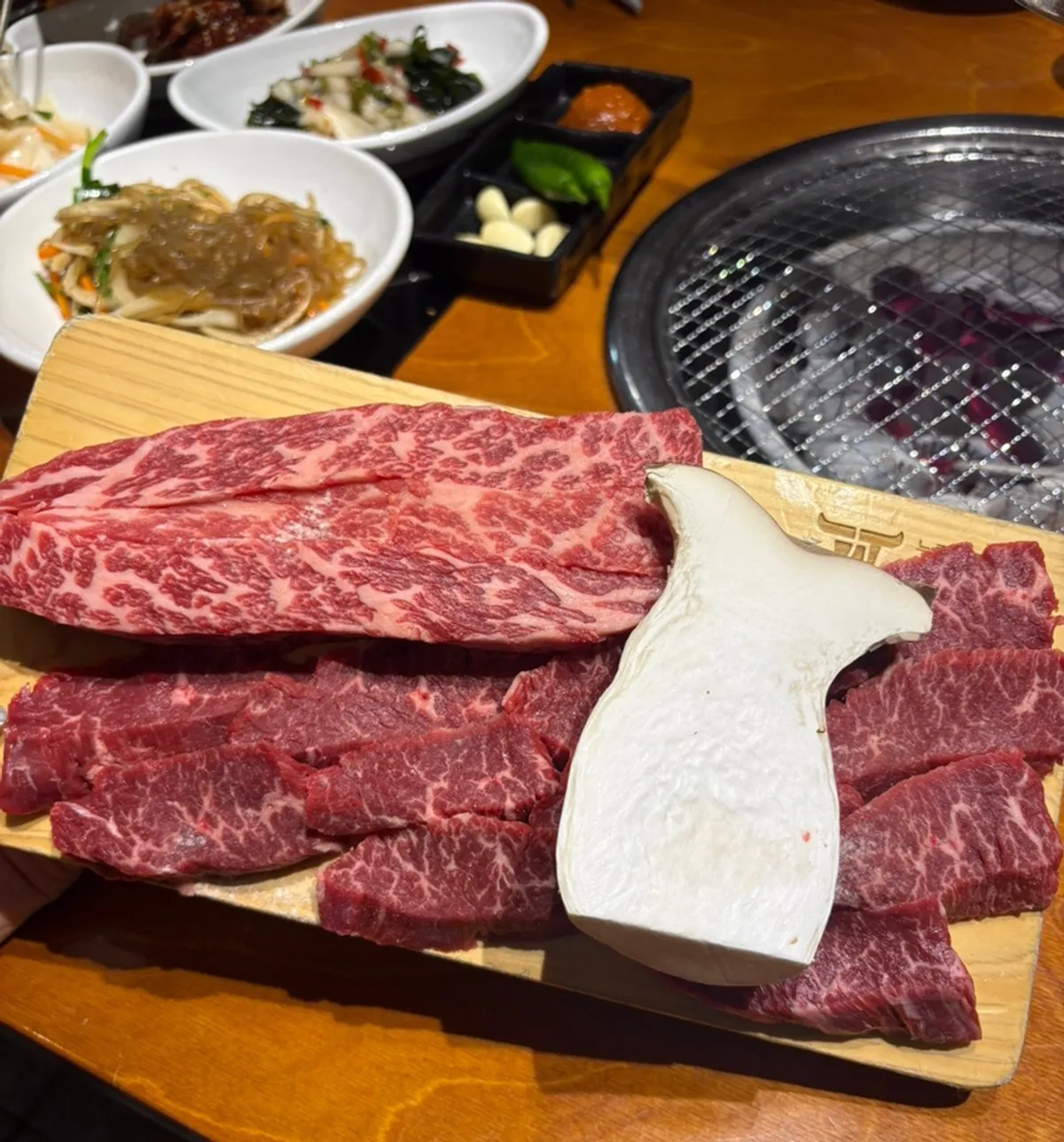 Raw skirt steak and flower short rib with visible marbling