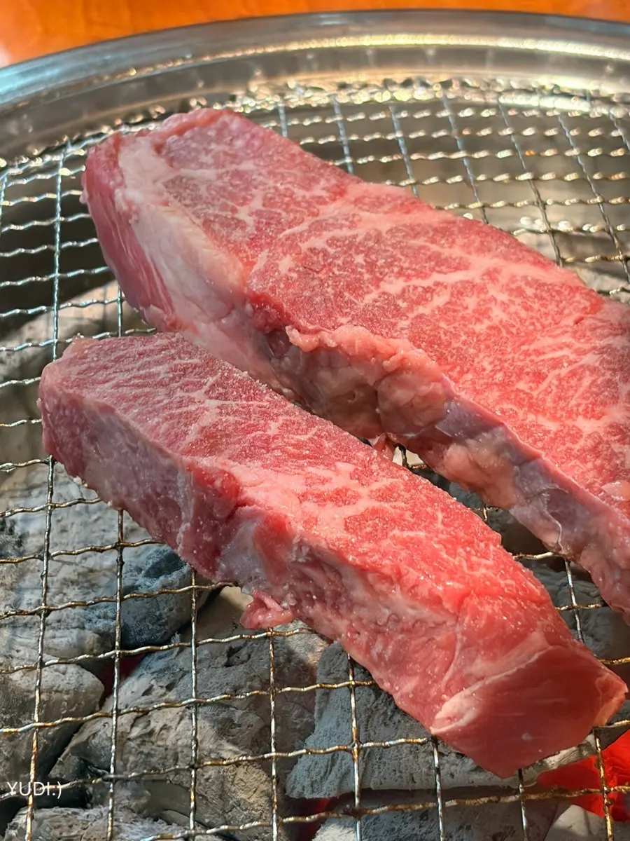 A piece of beef topped with fresh wasabi