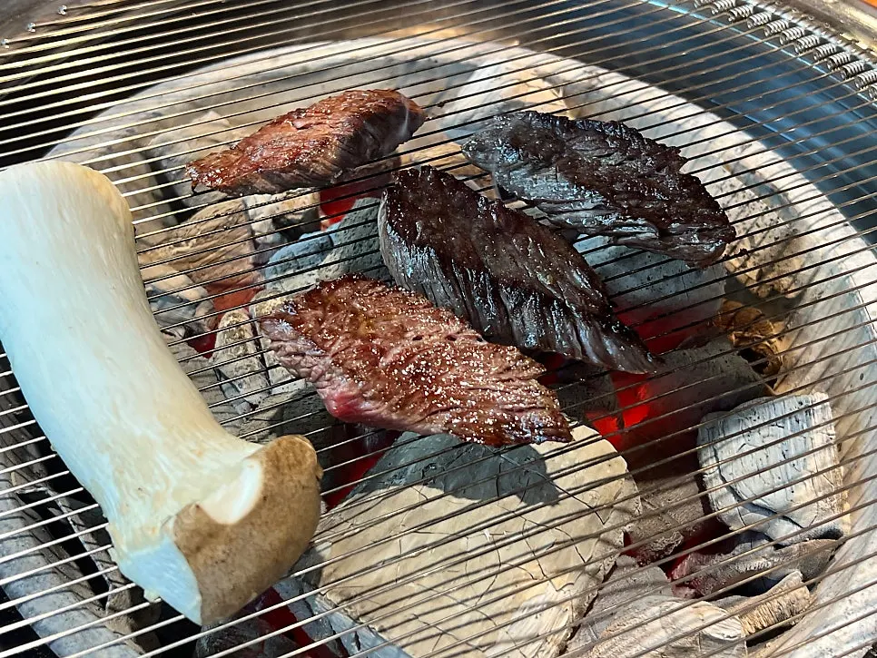 Pork kimchi stew kept warm beneath the grill
