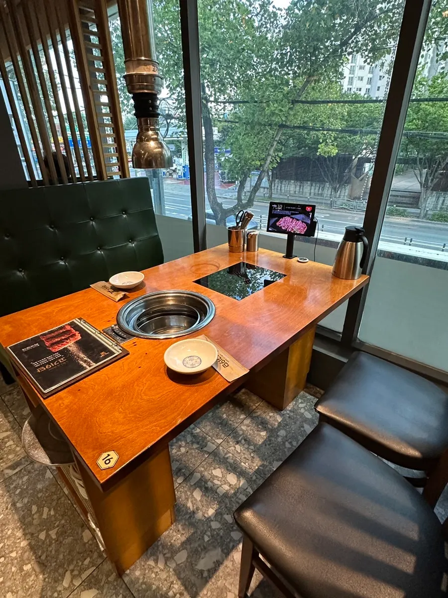 Spacious table seating next to the full window