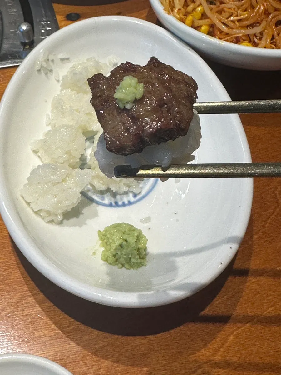 Beef sushi topped with wasabi