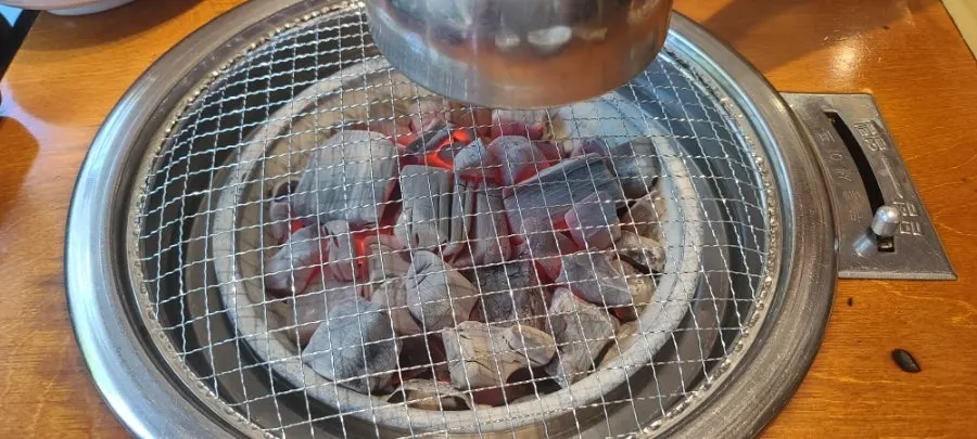 Grill table with the charcoal lit