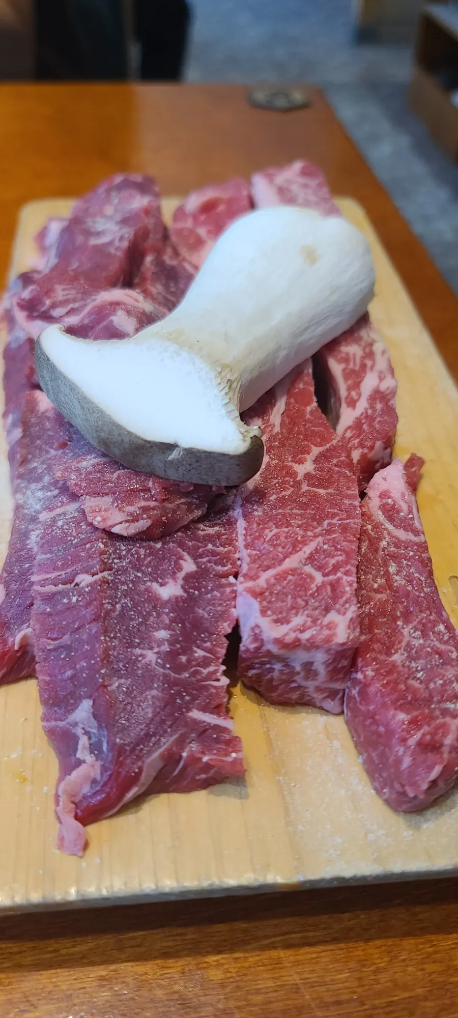 Skirt steak and flower short rib on a wooden board