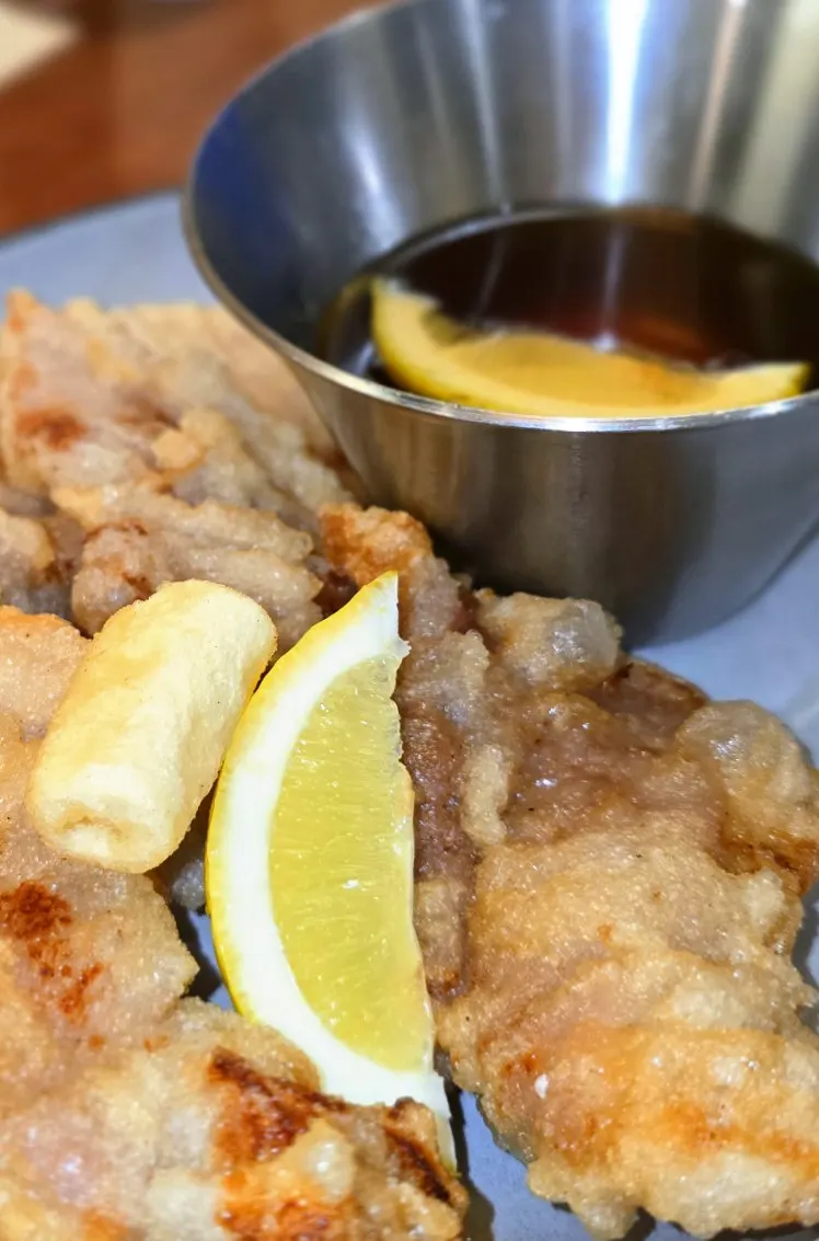 Tangsuyuk dipping sauce with a whole lemon inside