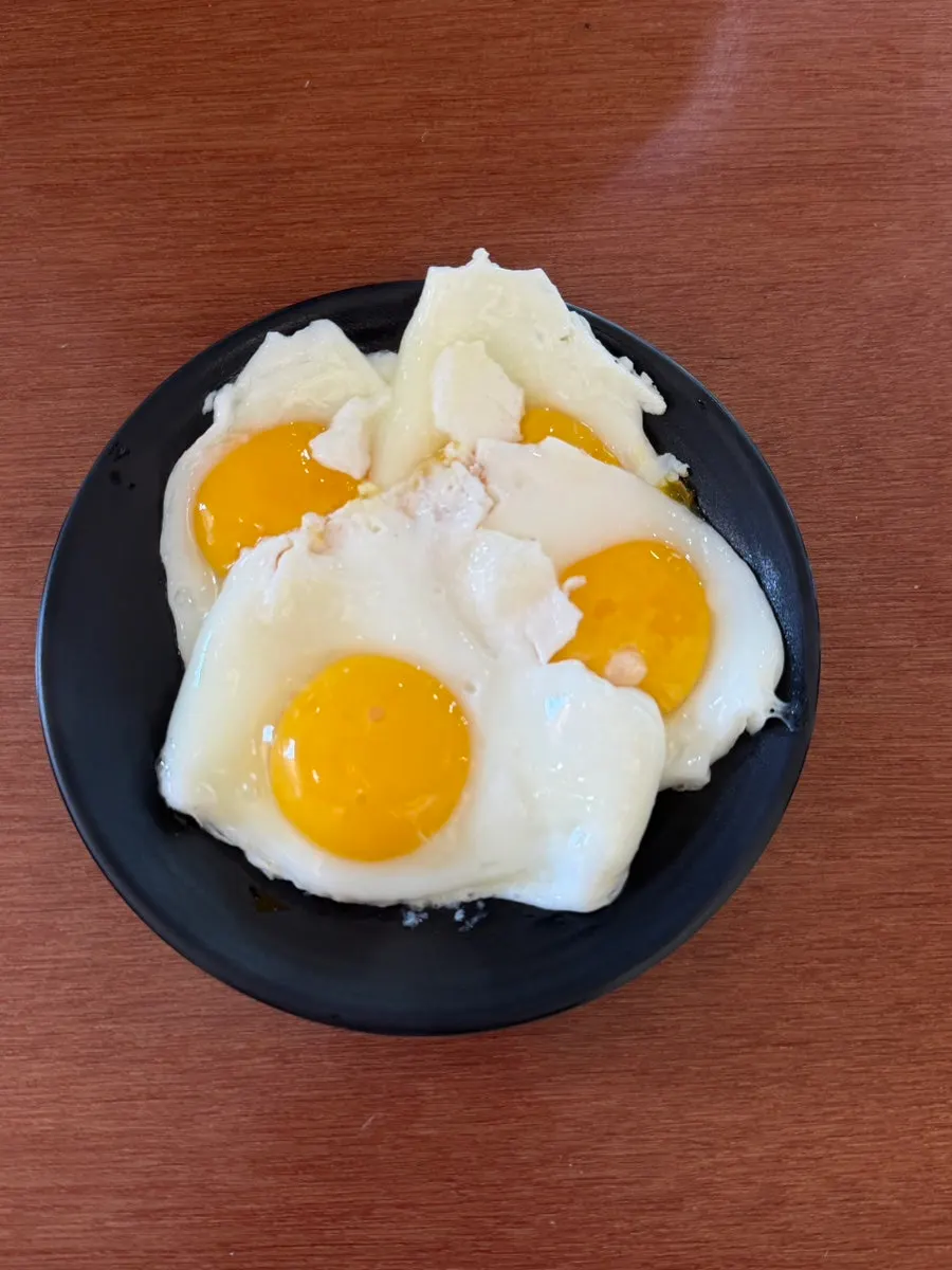 Soft-yolk fried egg cooked at the self-serve bar