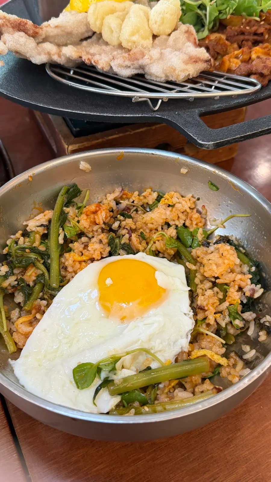 Siraegi bibimbap topped with a soft-yolk fried egg