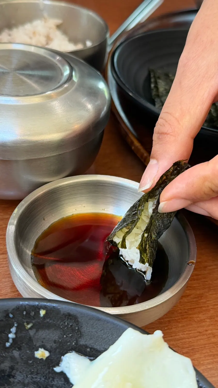 A bite of rice wrapped in seaweed