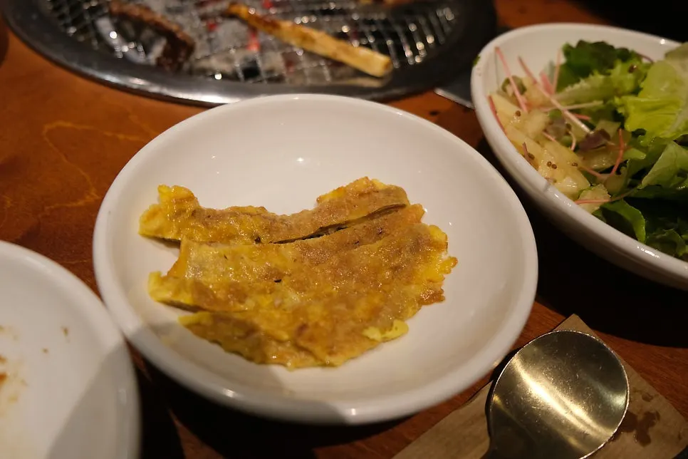 Complimentary plate of beef jeon