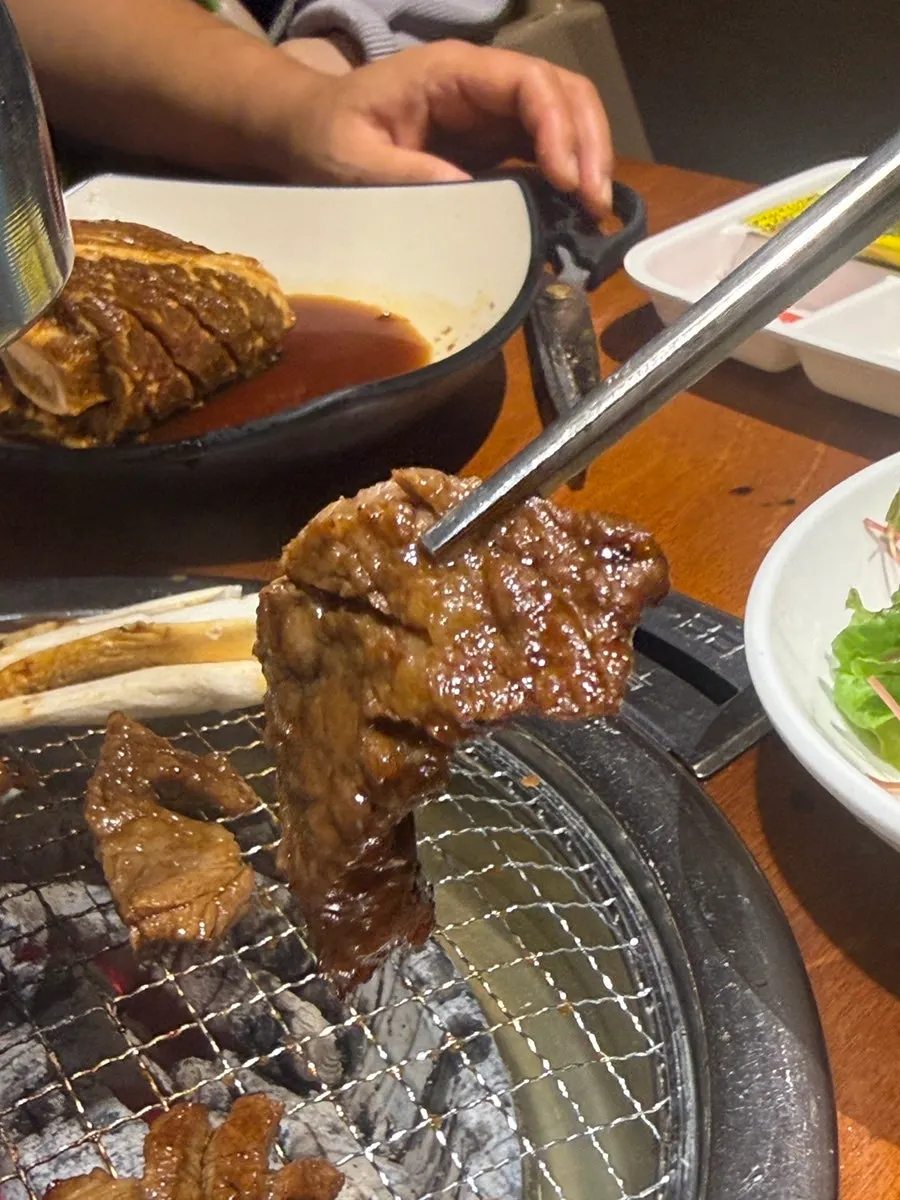 A piece of beef rib eaten with rice