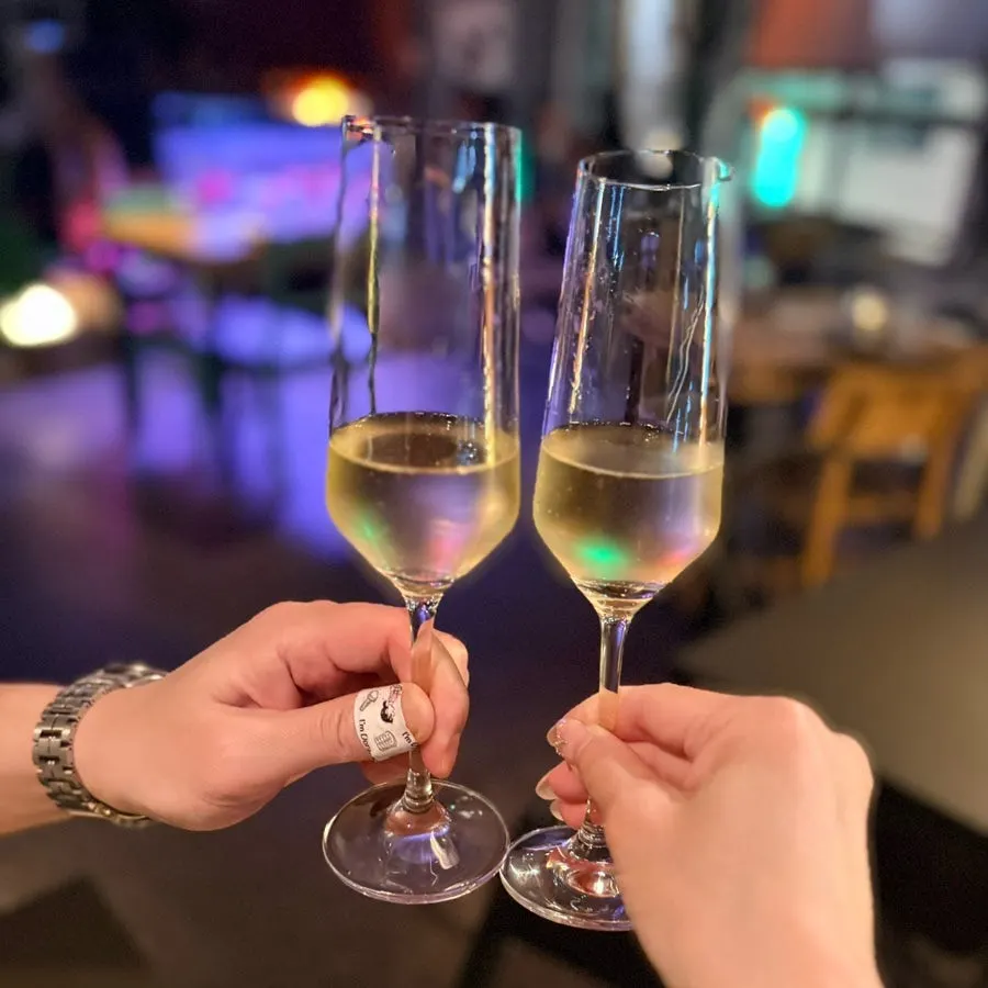A glass of sparkling wine under soft lighting