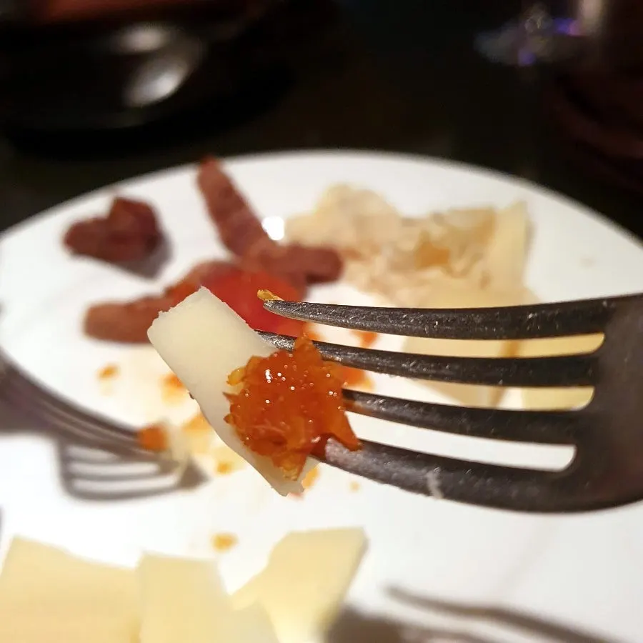 A plate combining cheese with its accompaniments