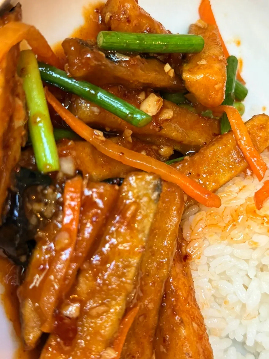 Close-up of fried eggplant tossed in fish-fragrant sauce