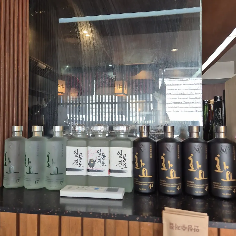 Menu board listing the animal-label sake lineup