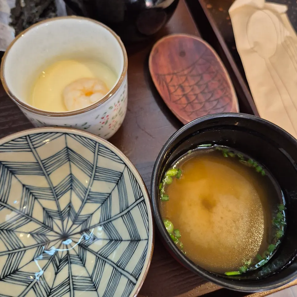 Steamed egg topped with a cocktail shrimp
