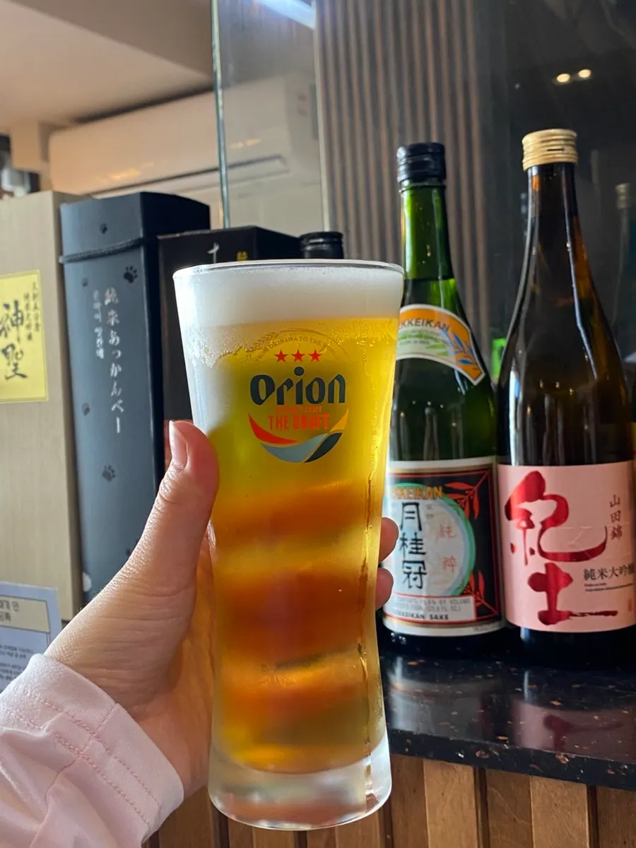 Orion draft beer ordered alongside hitsumabushi