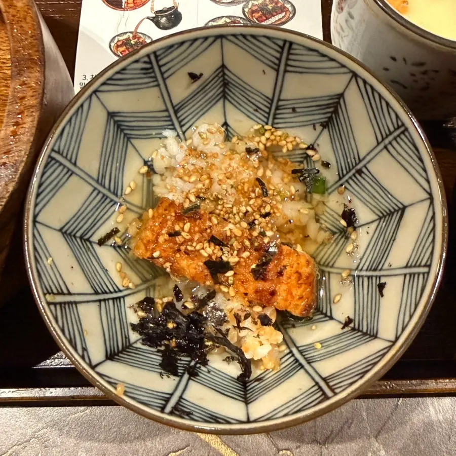 A spoonful of hitsumabushi showing plump eel flesh